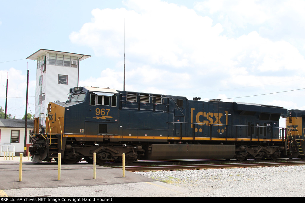 CSX 967 poses beside the yard tower